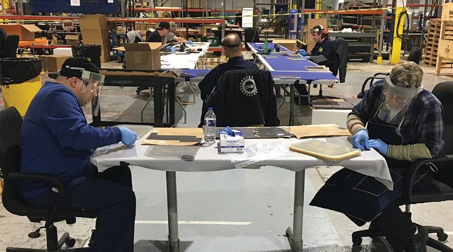 Workers at Ford subsidiary Troy Design and Manufacturing assemble face shields based on an open source design. Image: Troy Design and Manufacturing 